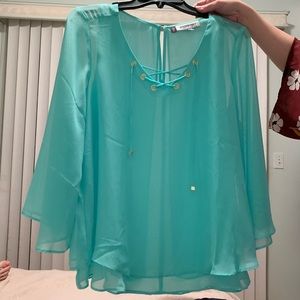 JLO teal blouse